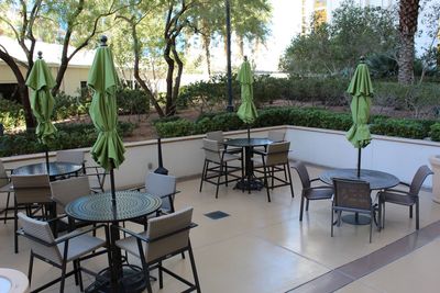 Outdoor dining area, each table with an umbrella